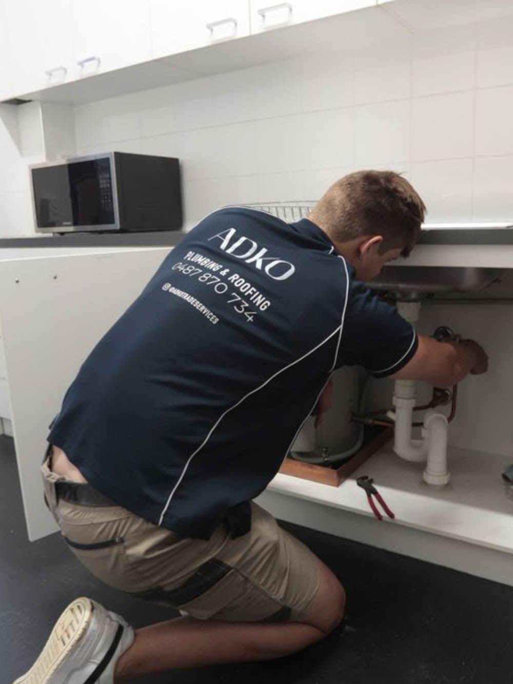 fixing a leak under the kitchen sink