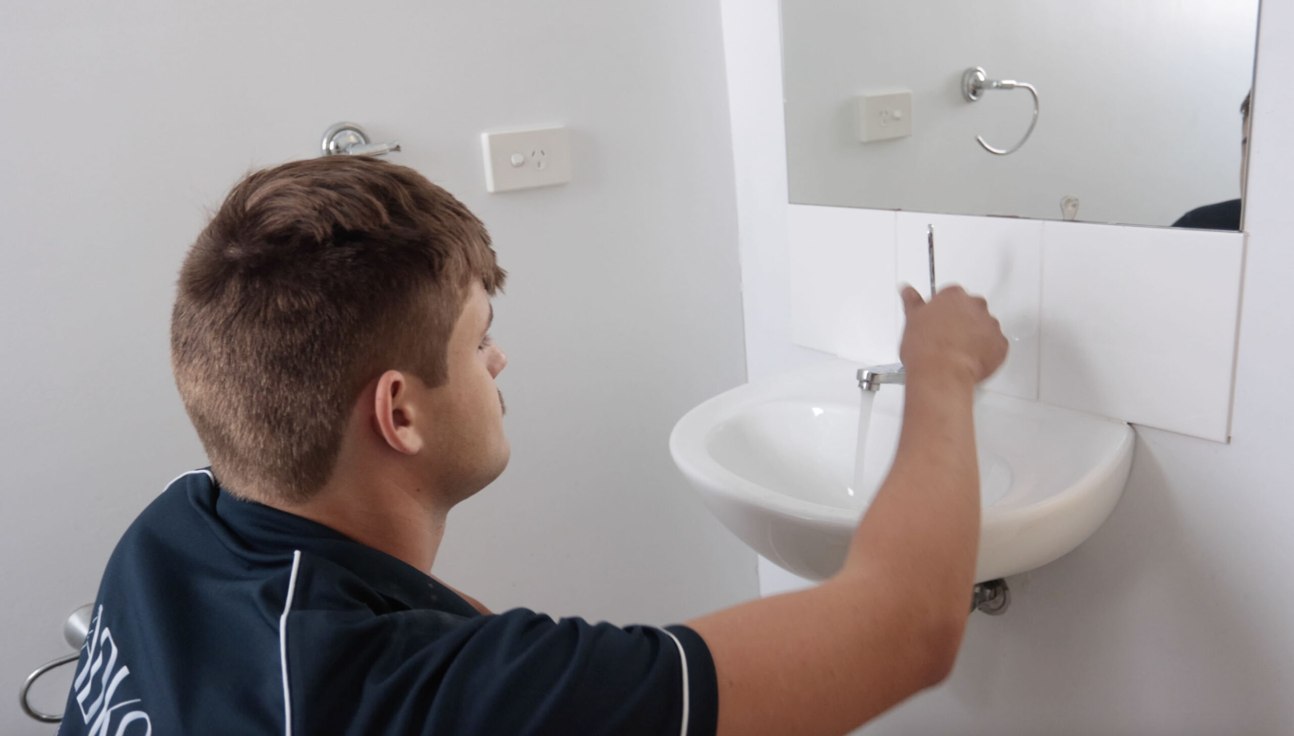checking a tap in a bathroom is working correctly